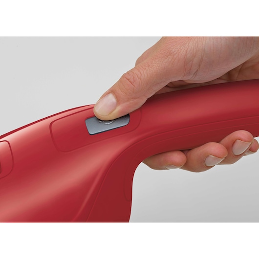 BLACK+DECKER APB3600 red handheld device close-up, thumb pressing gray power button, side view.