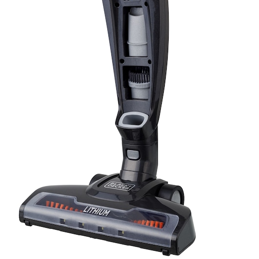 BLACK+DECKER AV160 cordless vacuum cleaner close-up, showing brush storage compartment and lithium power base.