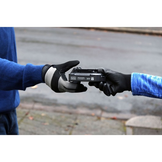 A person giving the power connect battery to someone else