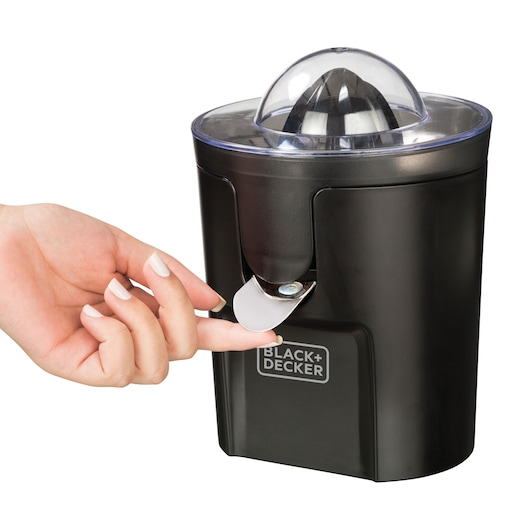 Photo of BLACK+DECKER CJ1000 black citrus juicer with transparent lid, side view, hand pressing spout.