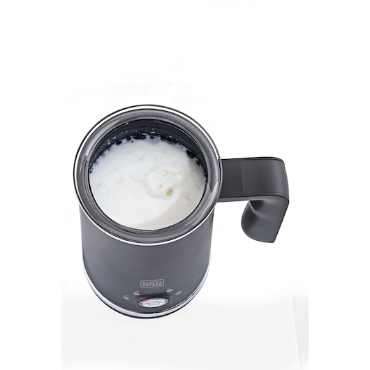 BLACKDECKER EL500 black milk frother with handle, photographed from above, showing frothed milk inside.