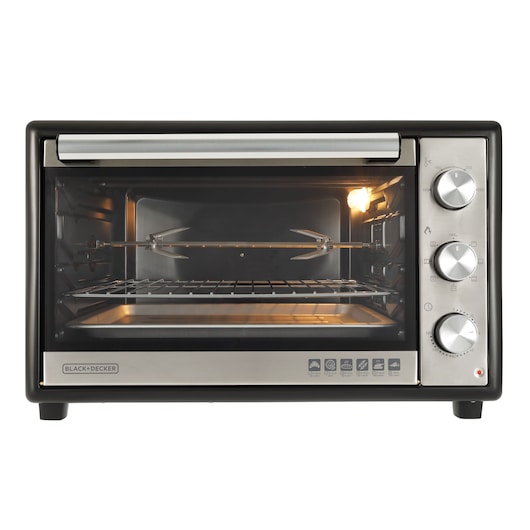 Photo of BLACK+DECKER FT60 countertop oven with stainless steel finish, three control dials, and interior racks, front view.