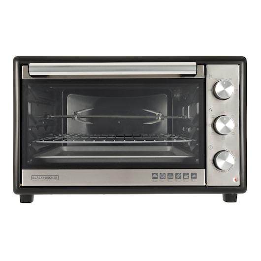 Photo of BLACK+DECKER FT60 countertop toaster oven with stainless steel front, three dials, and rotisserie rack, front view.