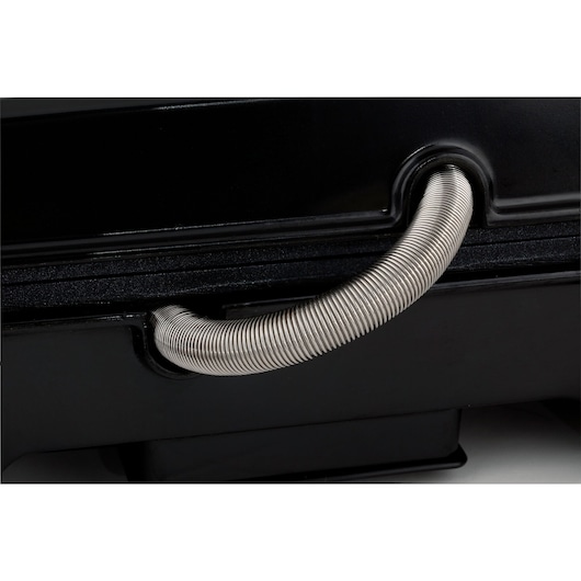 Photo of BLACKDECKER G1200 close-up showing a metal coil handle on a black surface, product detail angle.