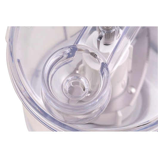 Close-up photo of BLACKDECKER MP120 food processor lid with clear plastic chute, top angle.