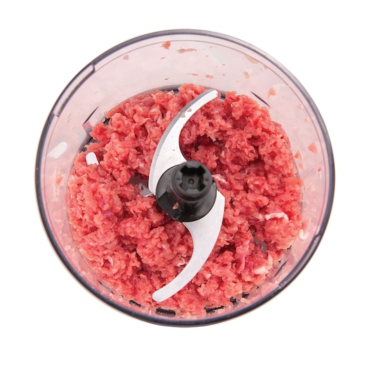 BLACKDECKER MP4 food processor bowl with ground meat, top view, white background.