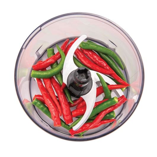 BLACKDECKER MP4 food chopper top view with red and green chili peppers inside the clear bowl.