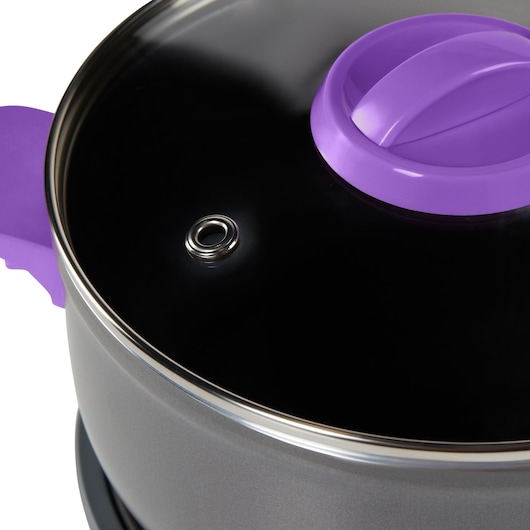 BLACKDECKER PC700 rice cooker closeup with glass lid, purple handle, and steam vent, side angle.